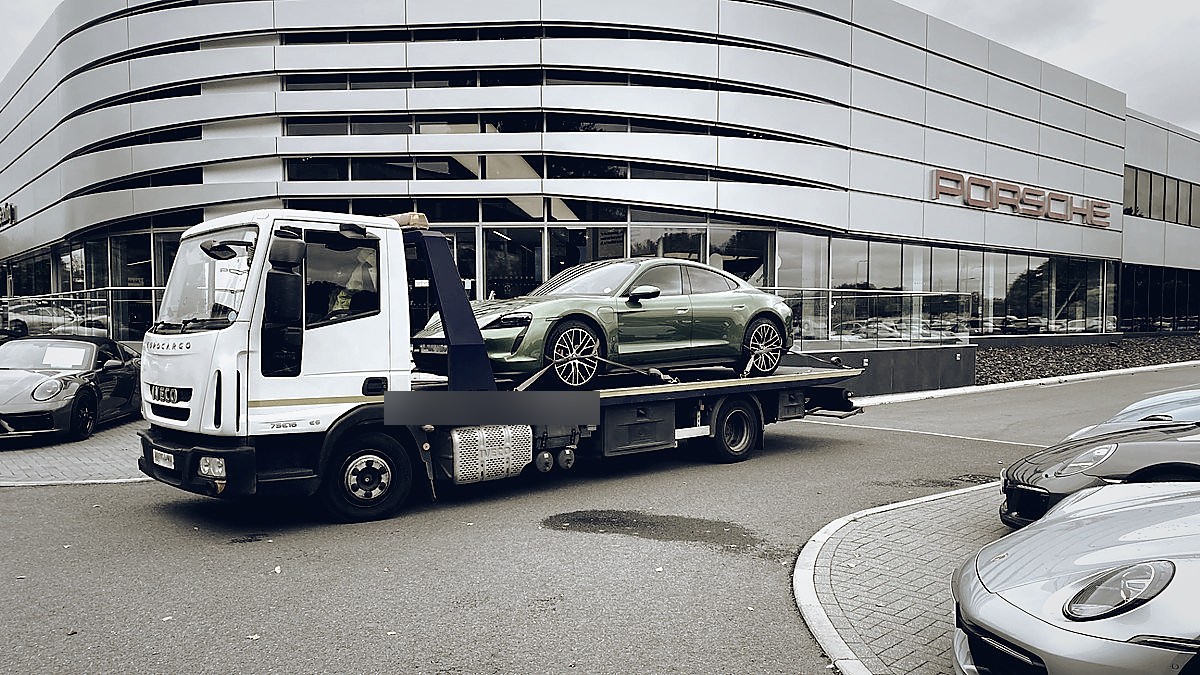 Porsche Taycan delivered to Porsche Centre forecourt — LTJ Transport dealership collection service